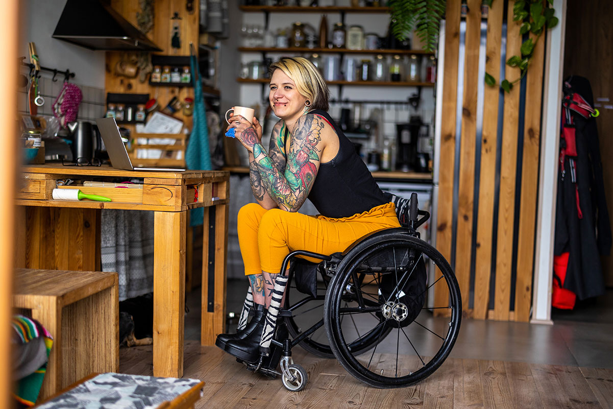 Woman in Wheelchair With Coffee